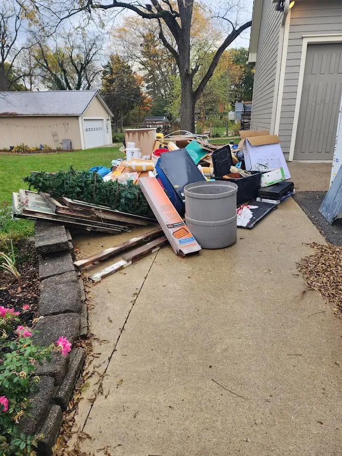 Dumpster being loaded with debris for Residential Dumpster Rental in Beloit